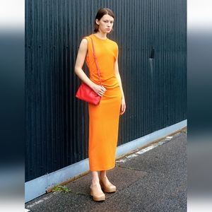 Sidraped orange dress